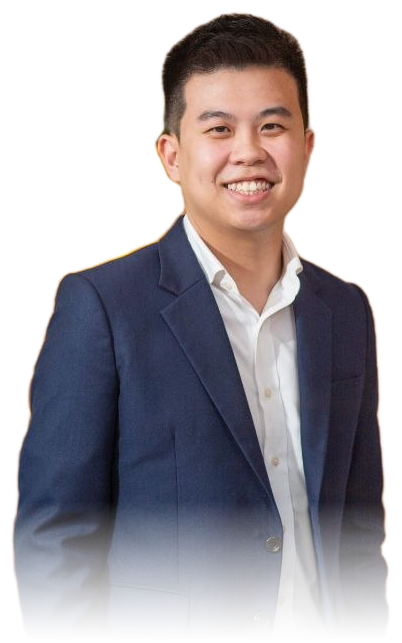 Aaron Tan in a navy suit, smiling